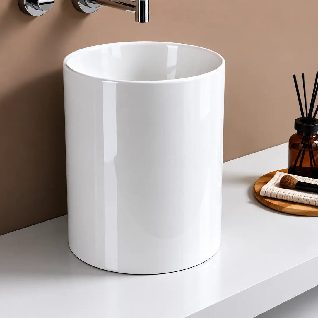 White freestanding sink on a bathroom counter with minimal decor